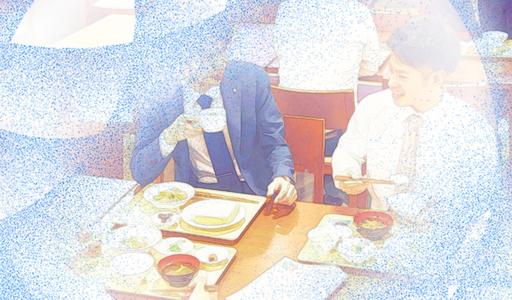 社員食堂で昼食を食べている場面をイメージした画像です。